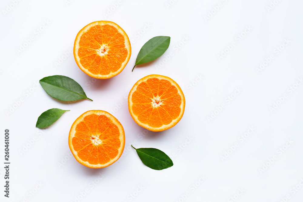 Fresh orange citrus fruits with leaves on white background.