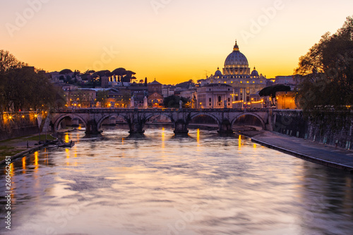 Twilight view of St. Peter's Basilica with Tiber River in Rome, Italy