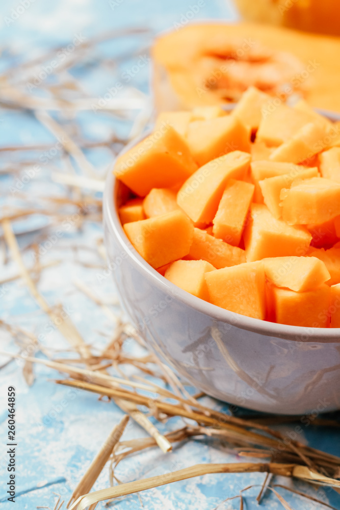 ingredients for pumpkin soup on a wooden background ingredients for pumpkin soup on a wooden background