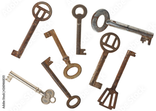set of original weathered rusty keys isolated on white background © Alisa