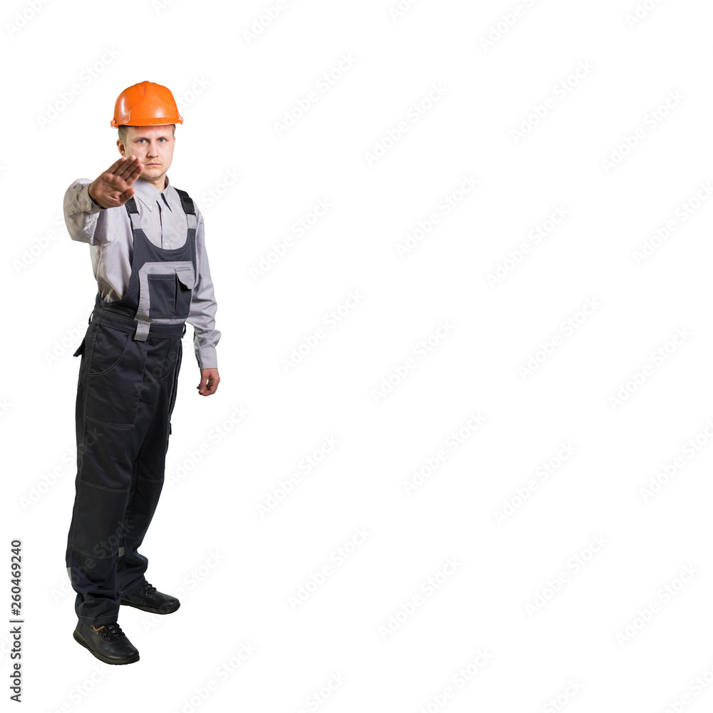 Builder engineer in a helmet palm prohibits gesture. Isolated Builder engineer in a helmet palm prohibits gesture. Isolated