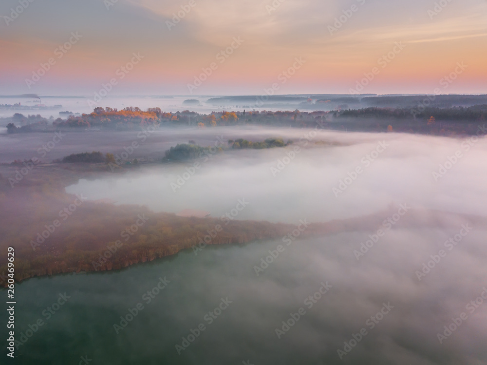 Beautiful misty dawn. Flying above the clouds, aerial view