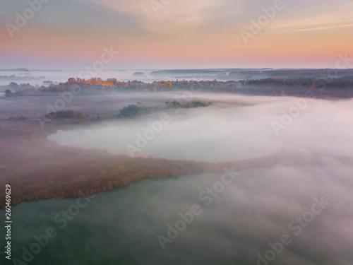 Beautiful misty dawn. Flying above the clouds, aerial view