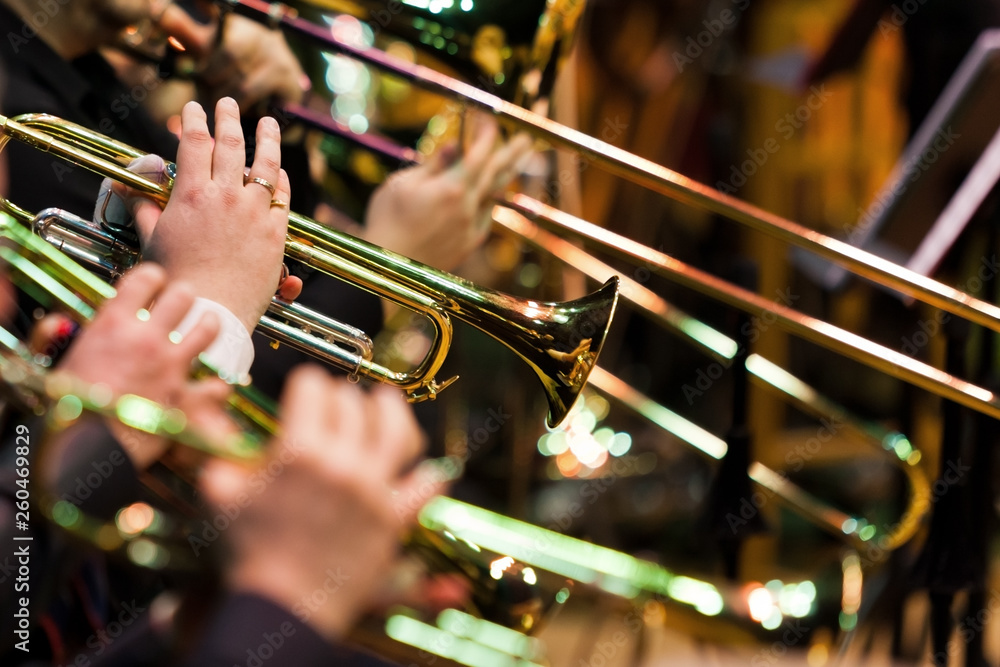 Obraz premium Trumpets in the hands of musicians in the orchestra