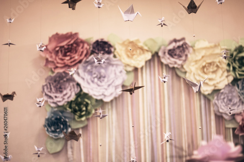Origami folded paper flowers and birds
