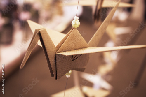 Folded brown paper bird