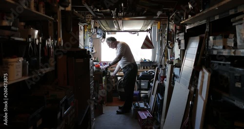 Senior Man Working in his Workshop photo