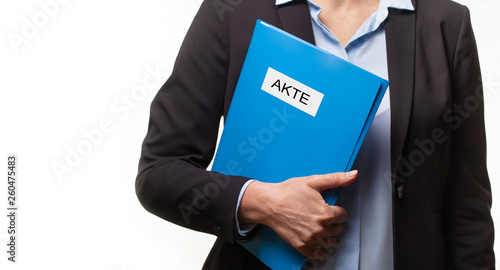 businessman holding a file or a binder.