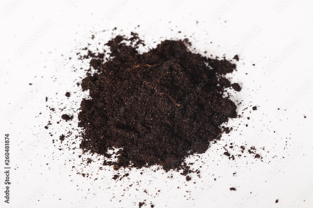 Pile of black fertile soil on white background. Heap dirt on white background. World soil day concept Pile of black fertile soil on white background. Heap dirt on white background. World soil day concept