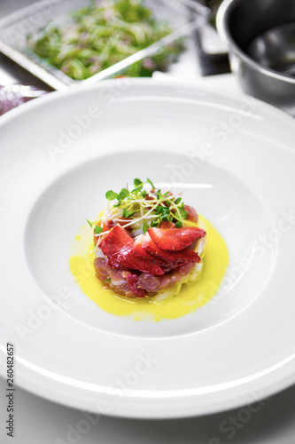 Tuna with strawberries and microgrin photo