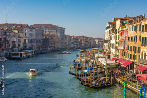 Italy, Venice, view of the Grand Canal at sunset with boats and gondolas.