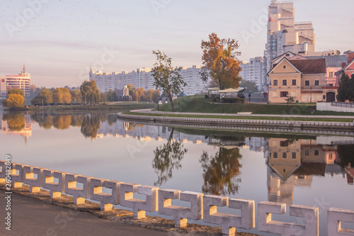 Wallpaper Mural Minsk, Belarus. Trinity Suburb is reflected in the river Svisloch. Early morning. Torontodigital.ca