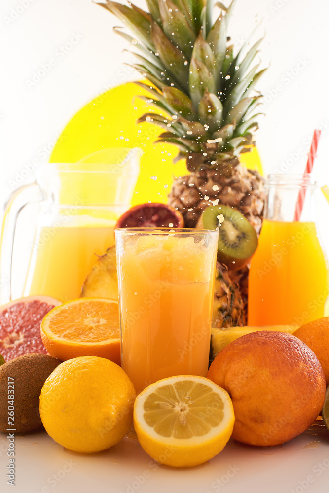 Fresh juice dynamic splash. A glass of fruit drink and fruits on a white background. Delicious, tasty, sweet summer set. Fresh juice dynamic splash. A glass of fruit drink and fruits on a white background. Delicious, tasty, sweet summer set.