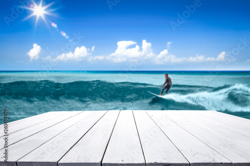 Summer table background of free space and surfer on waves. 