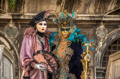 Venice, carnival 2019, typical masks, beautiful clothes, posing for photographers and tourists.
