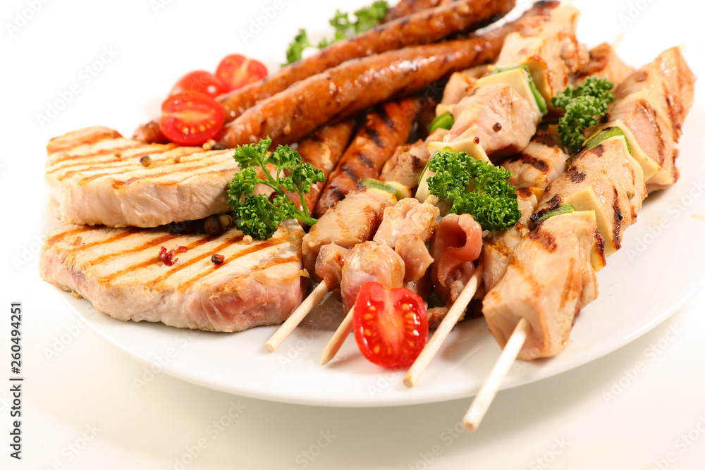 assorted barbecue meat with sausage, pork chop and beef skewer assorted barbecue meat with sausage, pork chop and beef skewer