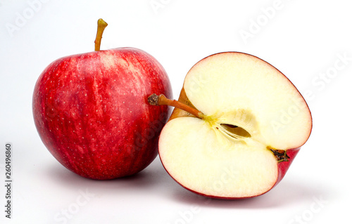 Red apple with apple half on white background, new zealand queen apple