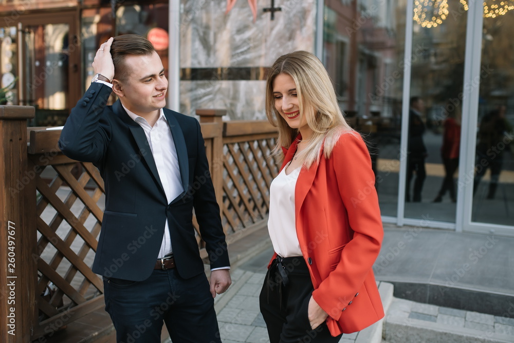 Business people walking and talking in the street ear of modern building. Business people walking and talking in the street ear of modern building.
