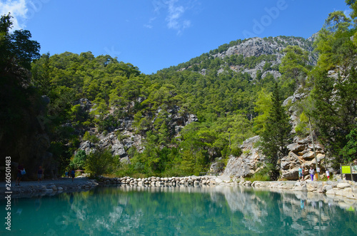 Turquoise lake on the background of mountains in the summer sunny day, Goynuk canyon near Kemer, Turkey