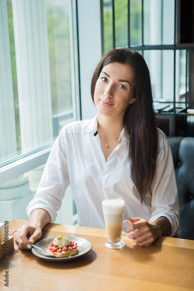 Attractive woman in cafe.
