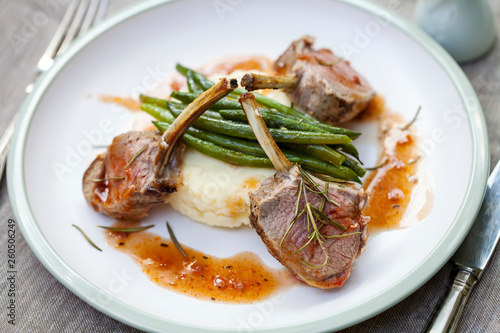Lamb rack with mashed potatoes, green beans and red wine jus 