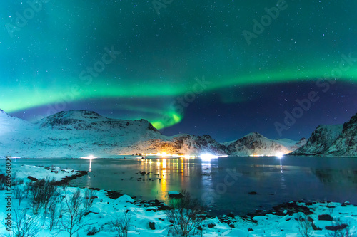 amazing view of Northern light in Lofotem island with big mountains in background