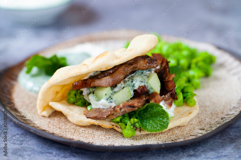 Mini flat breads with crispy lamb, mashed peas, cucumber, mint and yogurt sauce Mini flat breads with crispy lamb, mashed peas, cucumber, mint and yogurt sauce