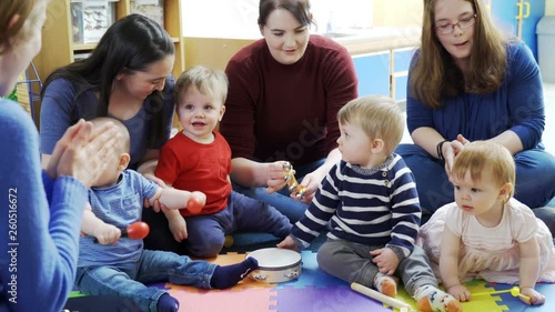 Mothers And Babies Playing Instruments And Singing At Music Group 