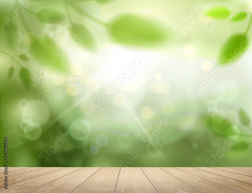Wooden table on green natural background. Template for advertising