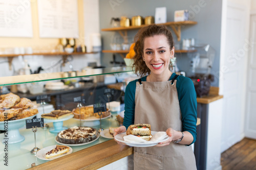Fotografie, Obraz Waitress ready to serve food in cafe