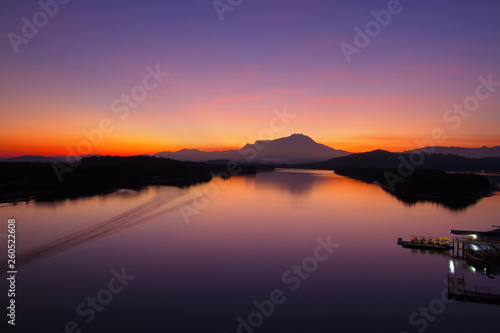 Scenery of beautiful sunrise with river and mountain in Borneo Asia