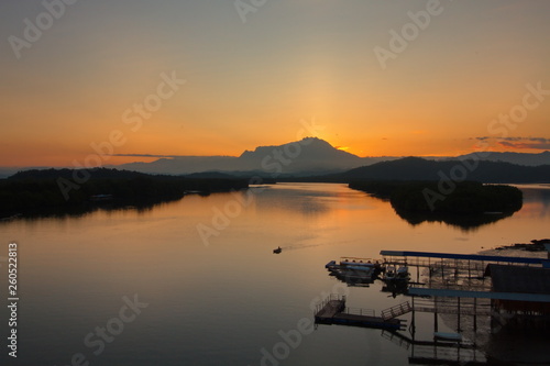 Scenery of beautiful sunrise with river and mountain in Borneo Asia
