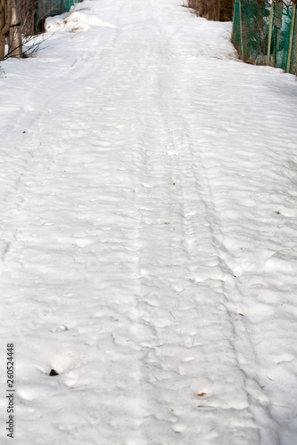 Wallpaper Mural spring snow village road with prints and tracks Torontodigital.ca