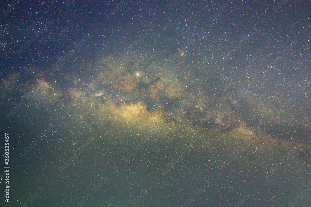 Fototapeta premium Clearly milky way galaxy rising in Borneo Asia, background of beautiful milky way. Long exposure photograph with grain. Image contain certain grain or noise and soft focus.