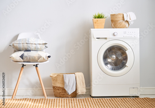 laundry room with a washing machine © Konstantin Yuganov