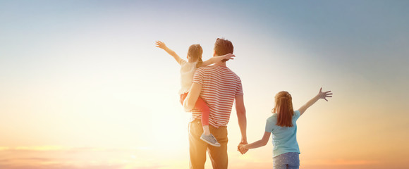 happy family at sunset.