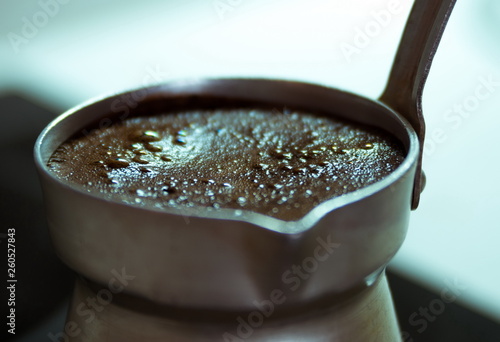 Boiling black coffee macro closeup