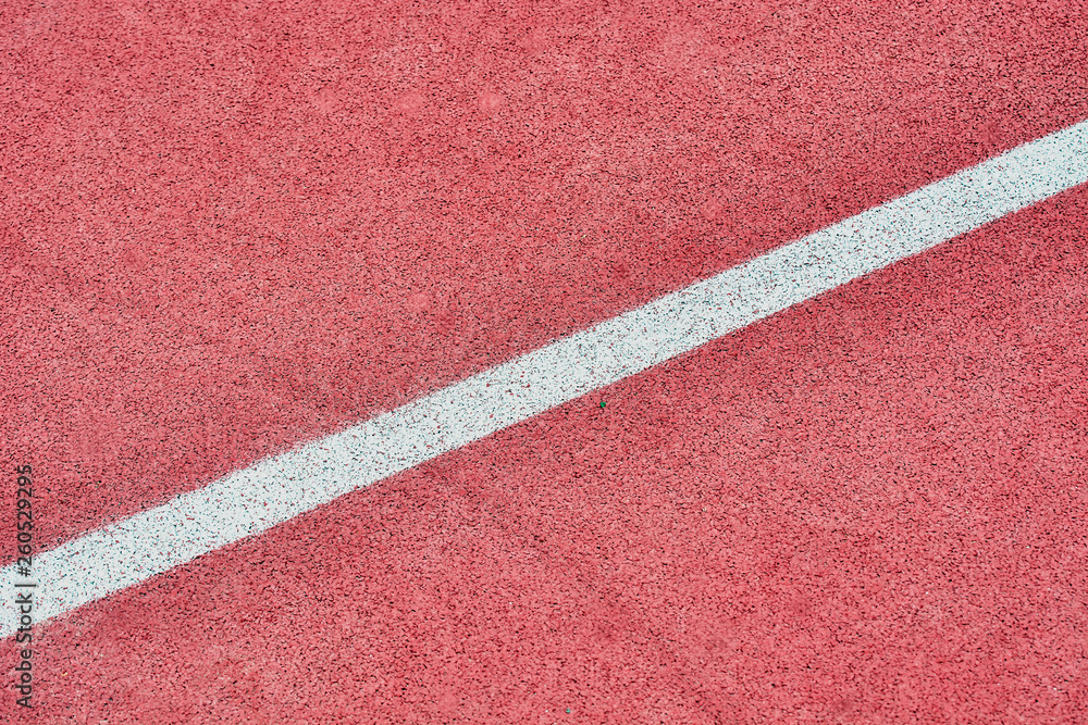 White line on red tennis court to play.