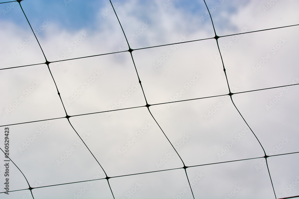 Beautiful volleyball net against the blue sky with clouds. Beautiful volleyball net against the blue sky with clouds.