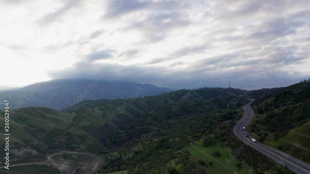 High Aerial View of cars driving on California highway in Tehachapi Mountains High Aerial View of cars driving on California highway in Tehachapi Mountains