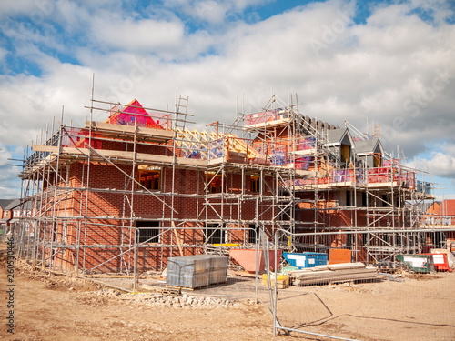 New build homes in scaffolding on an housing estate in Cheshire UK