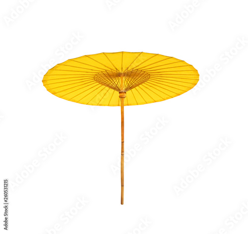 Colorful big yellow fabric umbrella with long wood handle isolated on white background with clipping path