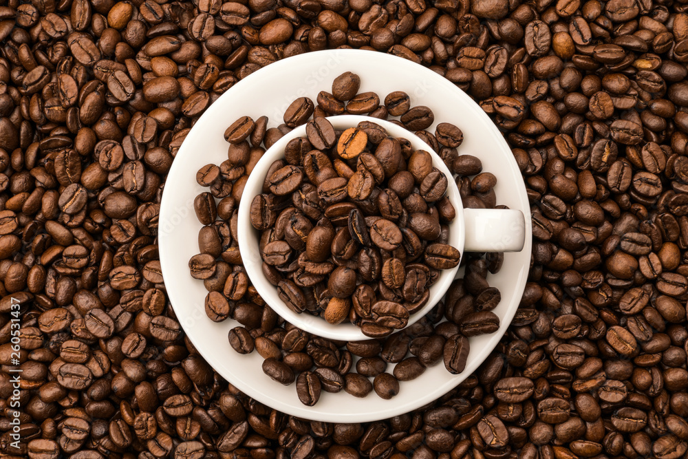 Cup of coffee with beans top view Cup of coffee with beans top view