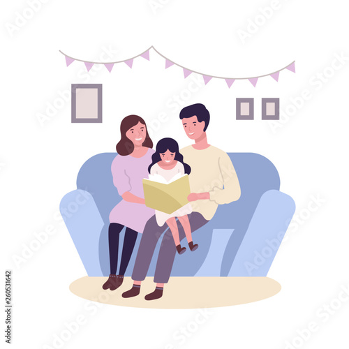 Happy happy family sitting on sofa and reading book or fairytale