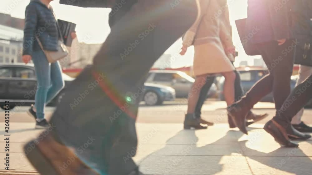 Unrecognizable Man in Suit and Platform Shoes is Crossing the Road with Crowds of People at a Big Pedestrian Crosswalk in City in Sunny Day. Slow Motion 4K Stock Video Footage Shot Unrecognizable Man in Suit and Platform Shoes is Crossing the Road with Crowds of People at a Big Pedestrian Crosswalk in City in Sunny Day. Slow Motion 4K Stock Video Footage Shot