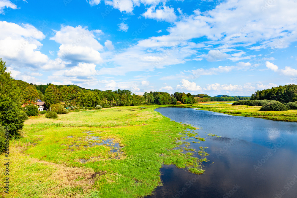 Naklejka premium Beautiful natural river landscape with forest and hills.