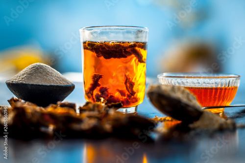 Best home remedy to treat acne and pimple on wooden surface i.e. Tamarind pulp,semolina and gram flour along with honey,On wooden surface in vintage containers. photo