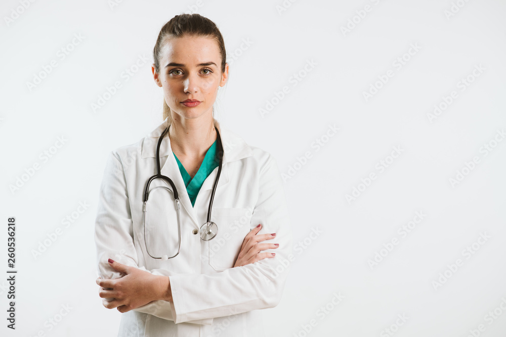 Young nurse in a scrub uniform wearing a stethoscope. Young nurse in a scrub uniform wearing a stethoscope.