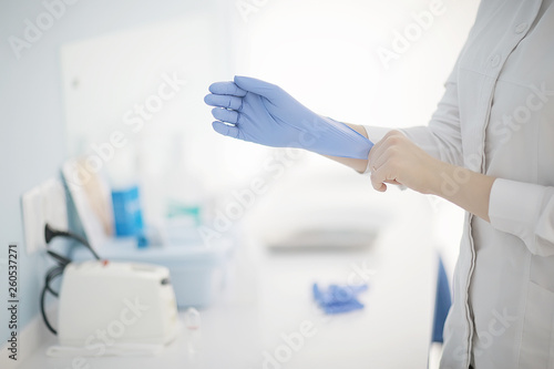 doctor in rubber gloves   concept sterility purity  medical clinic  laboratory  gloves on the hands of a doctor
