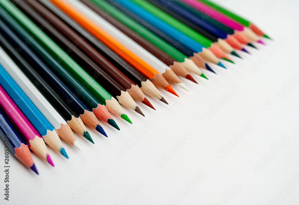 Colored pencils on a white background, with space for your text, blank for banner Colored pencils on a white background, with space for your text, blank for banner